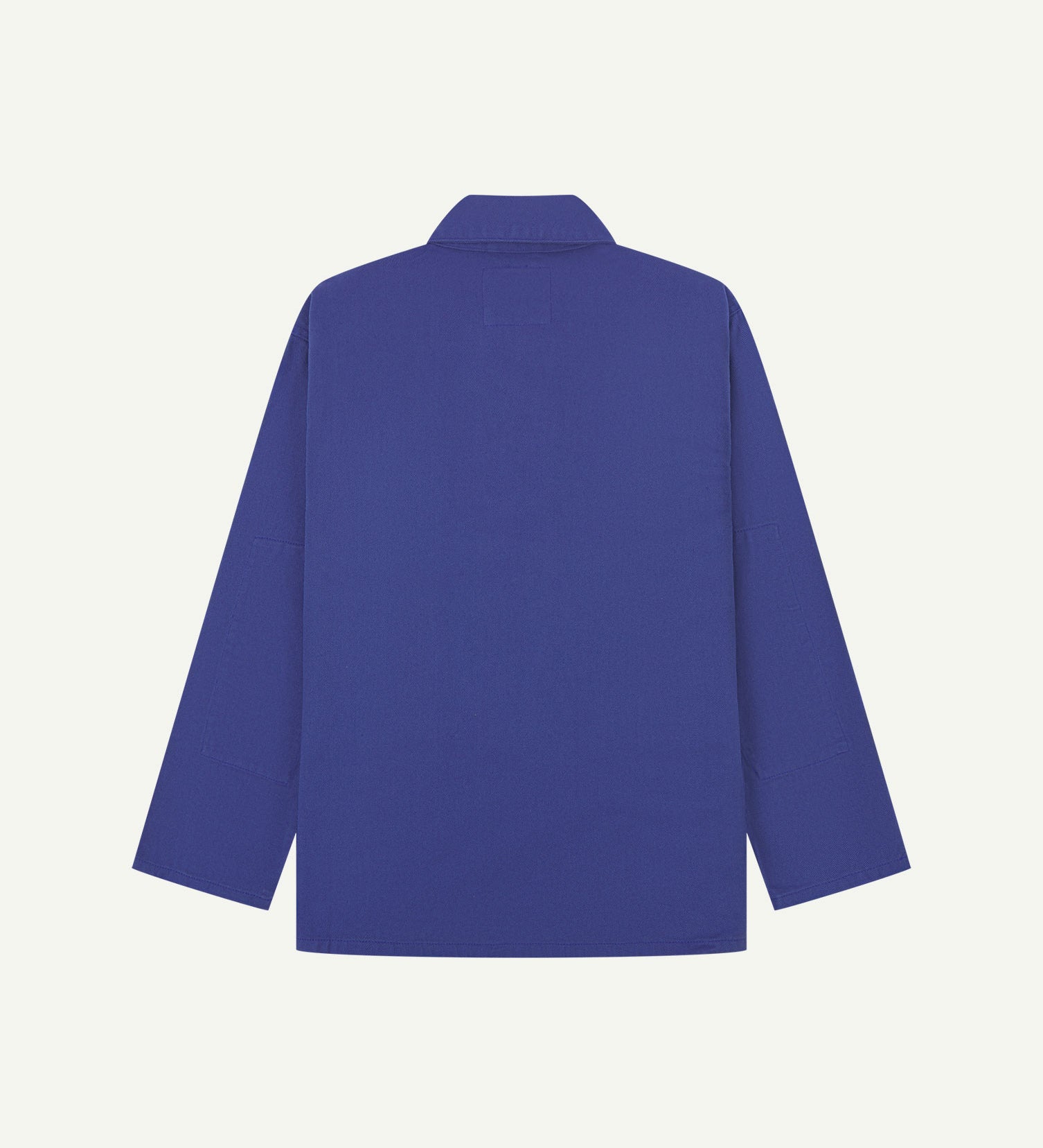 Reverse of ultra blue buttoned organic cotton drill overshirt from Uskees. Showing reinforced elbows and boxy silhouette.