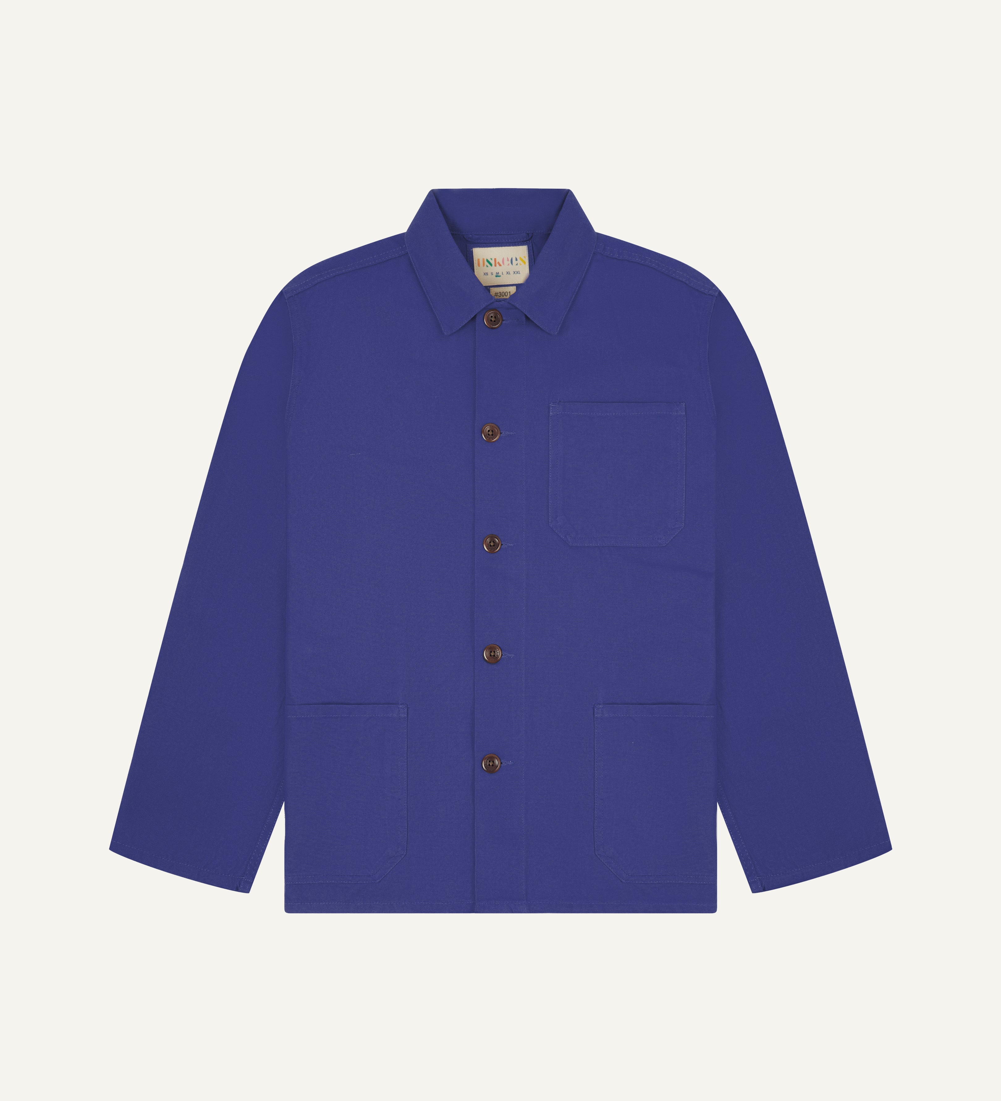 Front flat shot of an uskees bright blue men's overshirt showing brown corozo buttons and brand label at neck.
