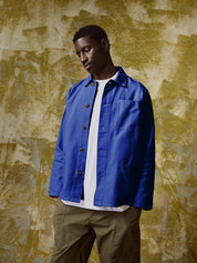 Full-length front view of model wearing 3001, 'ultra-blue' over shirt paired with khaki pants.