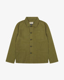 Front flat shot of khaki-green, buttoned linen blend overshirt. Clear view of corozo buttons, 3 pockets and Uskees branding label.