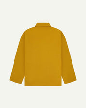 Back view of yellow, buttoned organic cotton overshirt with view of reinforced elbow area and boxy silhouette.