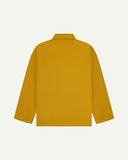 Back view of yellow, buttoned organic cotton overshirt with view of reinforced elbow area and boxy silhouette.