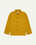 Front flat shot of yellow, buttoned organic cotton overshirt. Clear view of chest and hip pockets, corozo buttons and Uskees branding label.