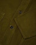Close-up of a green corduroy shirt-jacket showing the plant-based Corozo buttons