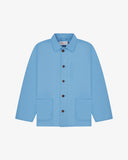 Front, flat view of a light blue Uskees shirt jacket with brown buttons on a light gray background 