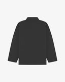 Back view of charcoal-grey, buttoned organic cotton overshirt with view of reinforced elbow area and boxy silhouette.
