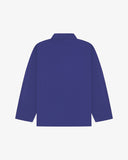 Back view of ultra blue, buttoned organic cotton overshirt with view of reinforced elbow area and boxy silhouette.