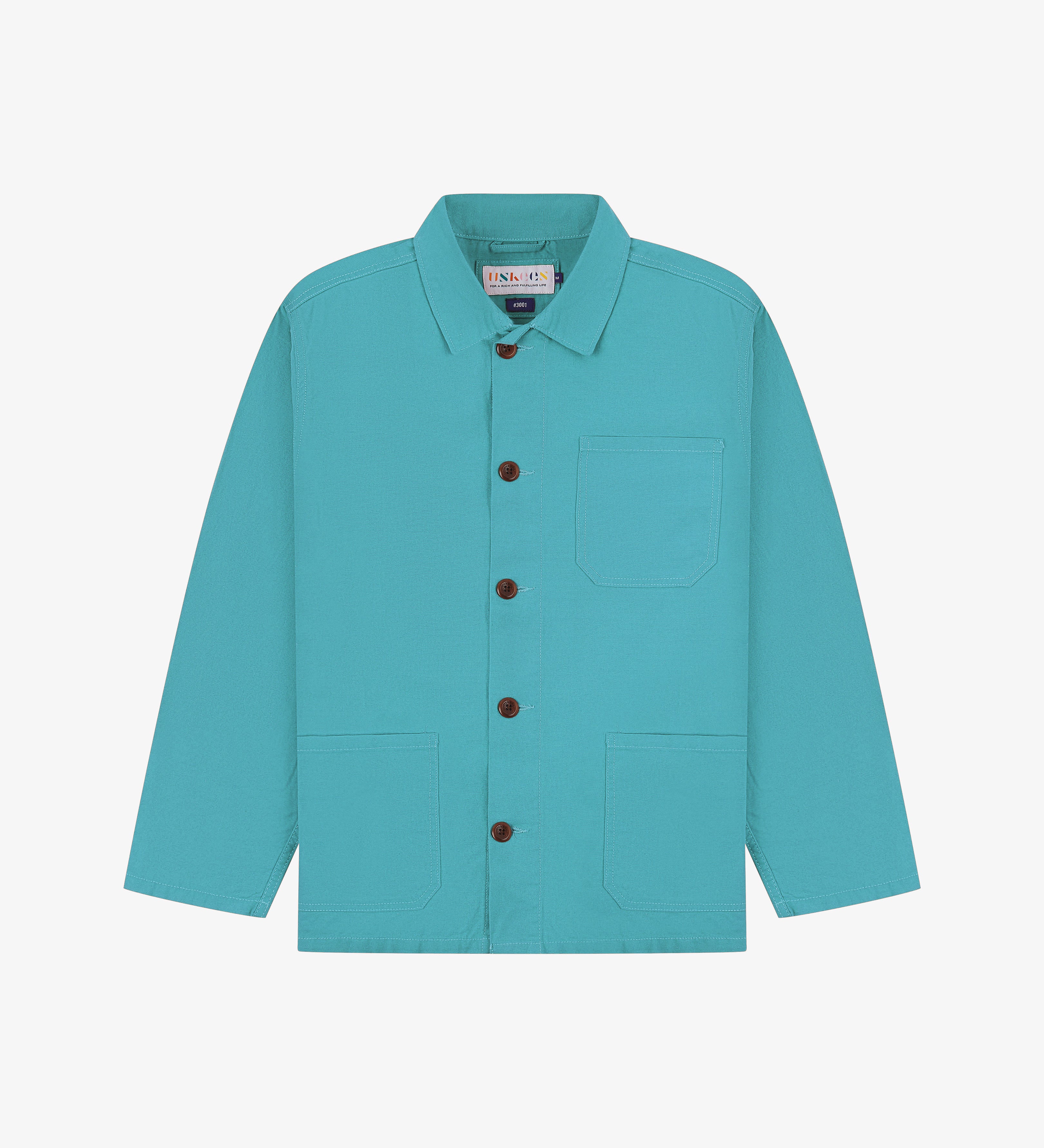 Front flat shot of turquoise blue Uskees overshirt with brown buttons on a light gray background