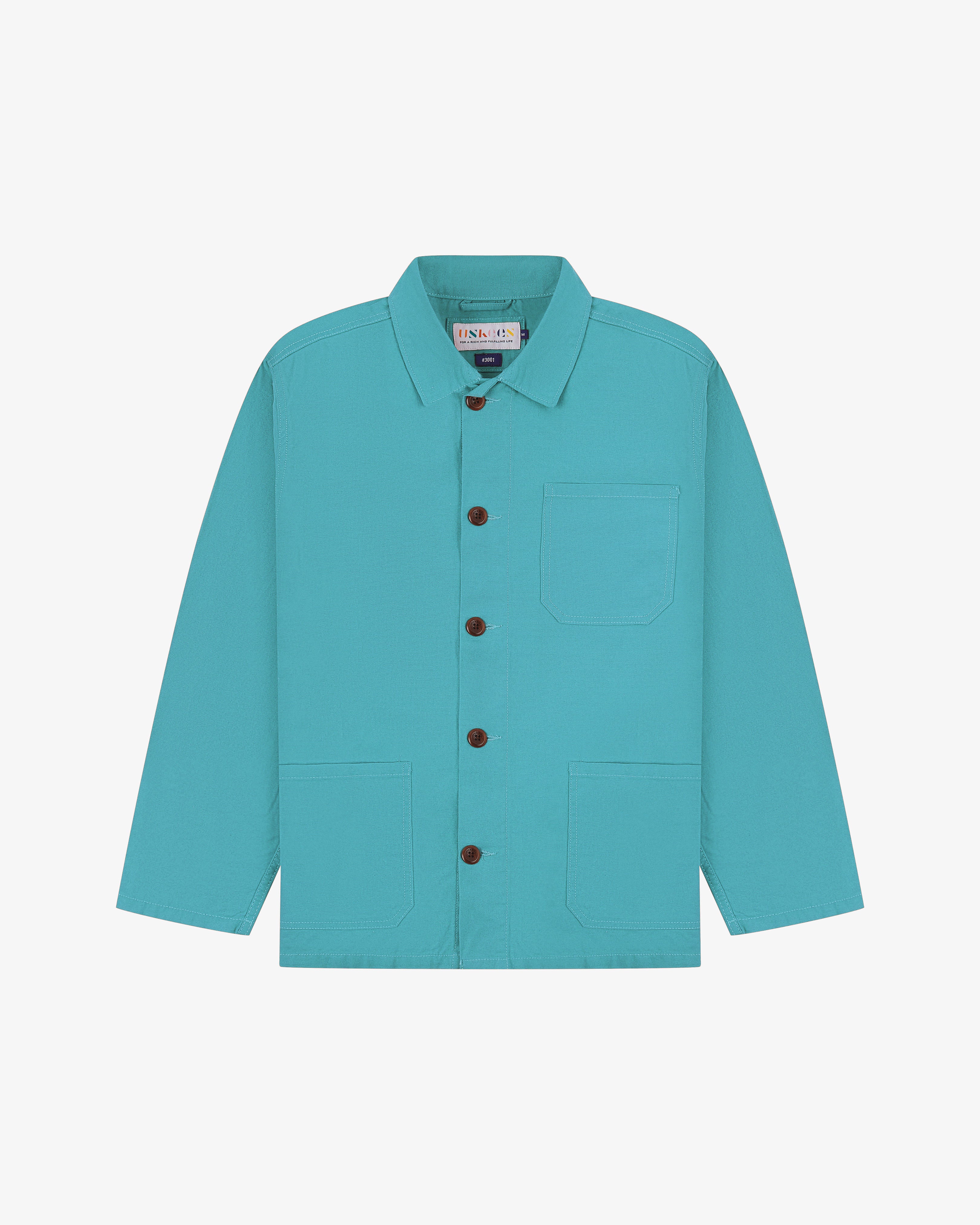 Front flat shot of turquoise blue Uskees overshirt with brown buttons on a light gray background