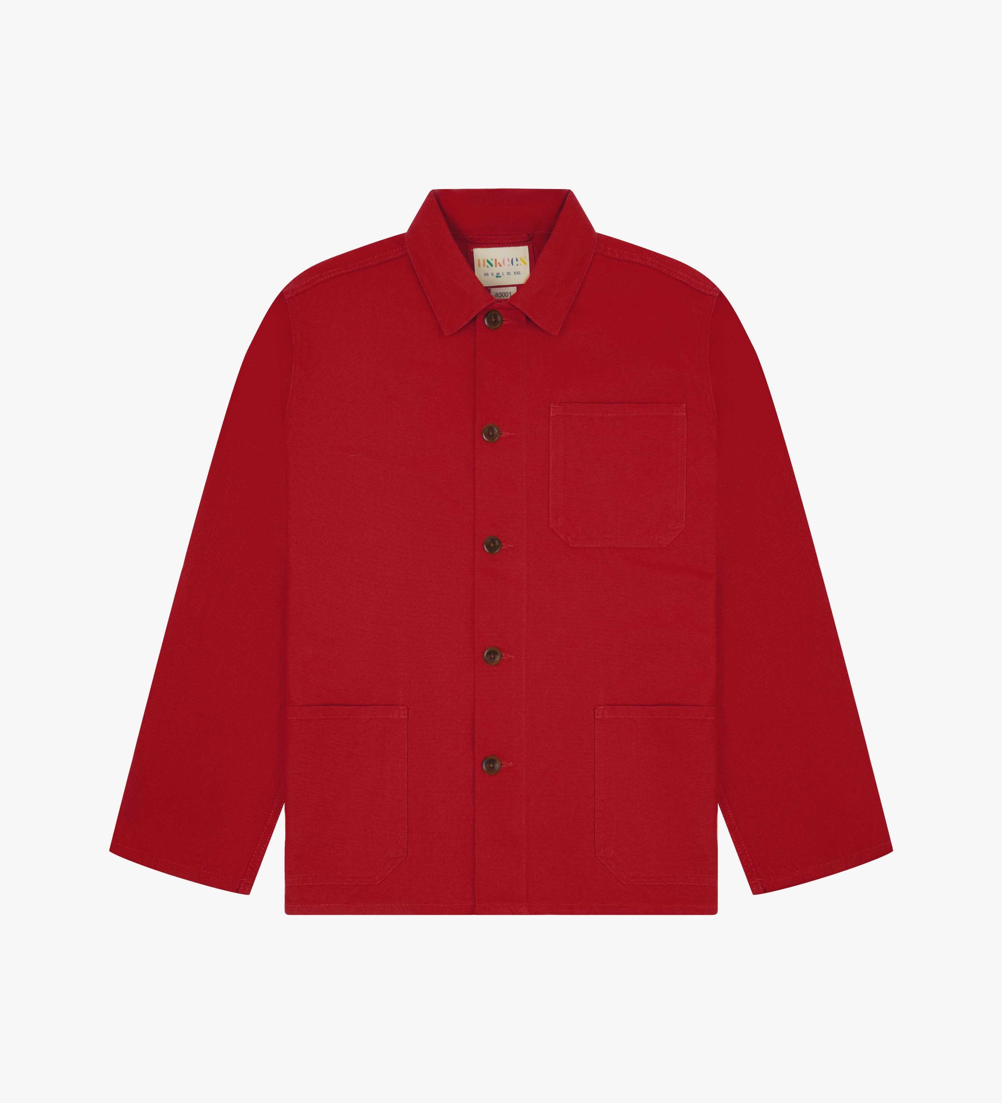 Front flat shot of berry red, buttoned organic cotton overshirt. Clear view of chest and hip pockets, corozo buttons and simple, boxy shape.
