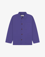 Front flat shot of an Uskees purple shirt jacket with brown Corozo buttons on a light gray background