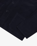 Close-up of a midnight blue overshirt showing the Corozo buttons, pocket and cuff on a white background.