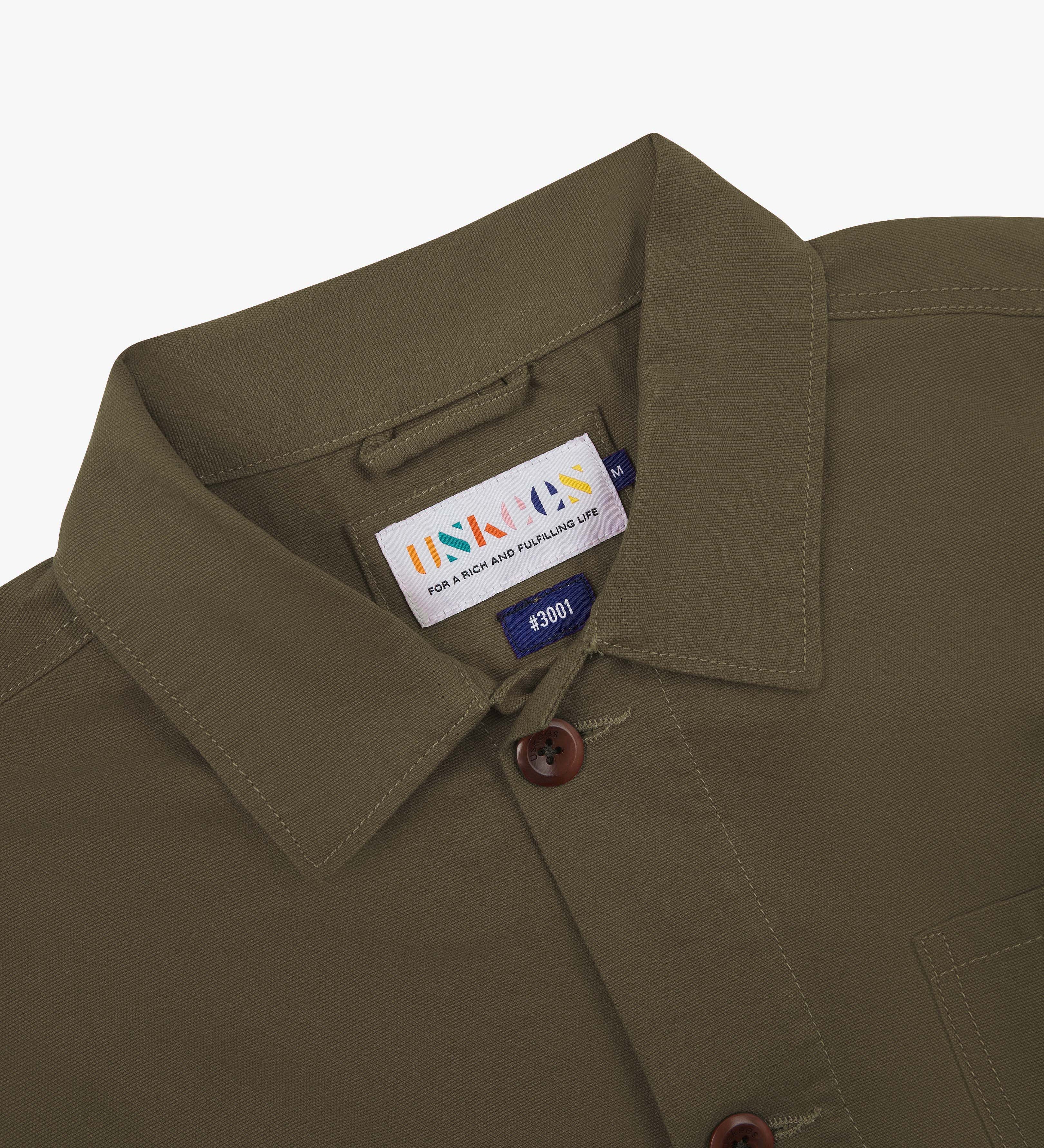 brown uskees overshirt collar showing the brand label on a white background