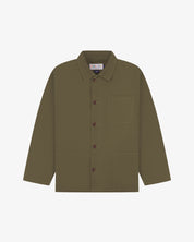 Green/brown shirt showing the Uskees brand label, collar and 3 front pockets on a white background.