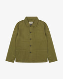 Front flat view of an Uskees green linen overshirt for men showing the 3 front pockets and Corozo buttons.