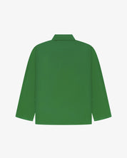 Back view of mint green, buttoned organic cotton overshirt with view of reinforced elbow area and boxy silhouette.