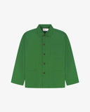 Front flat view of mint green, buttoned organic cotton overshirt. Clear view of chest and hip pockets, branding label, corozo buttons and simple, boxy profile.