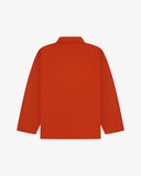 Back view of an orange uskees overshirt on a white background
