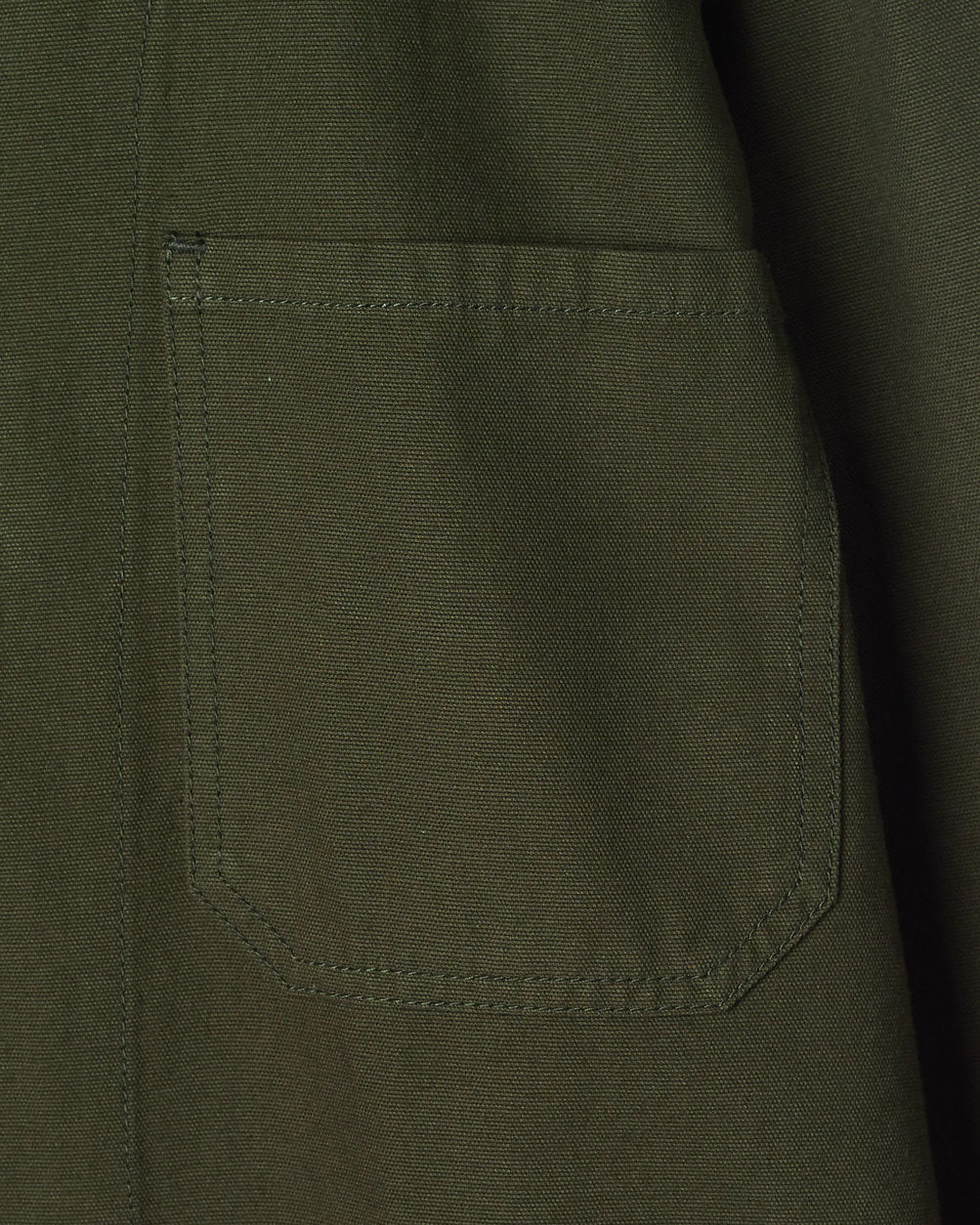 Close-up of #3002 vine green, organic cotton zip jacket focussing on the breast pocket.