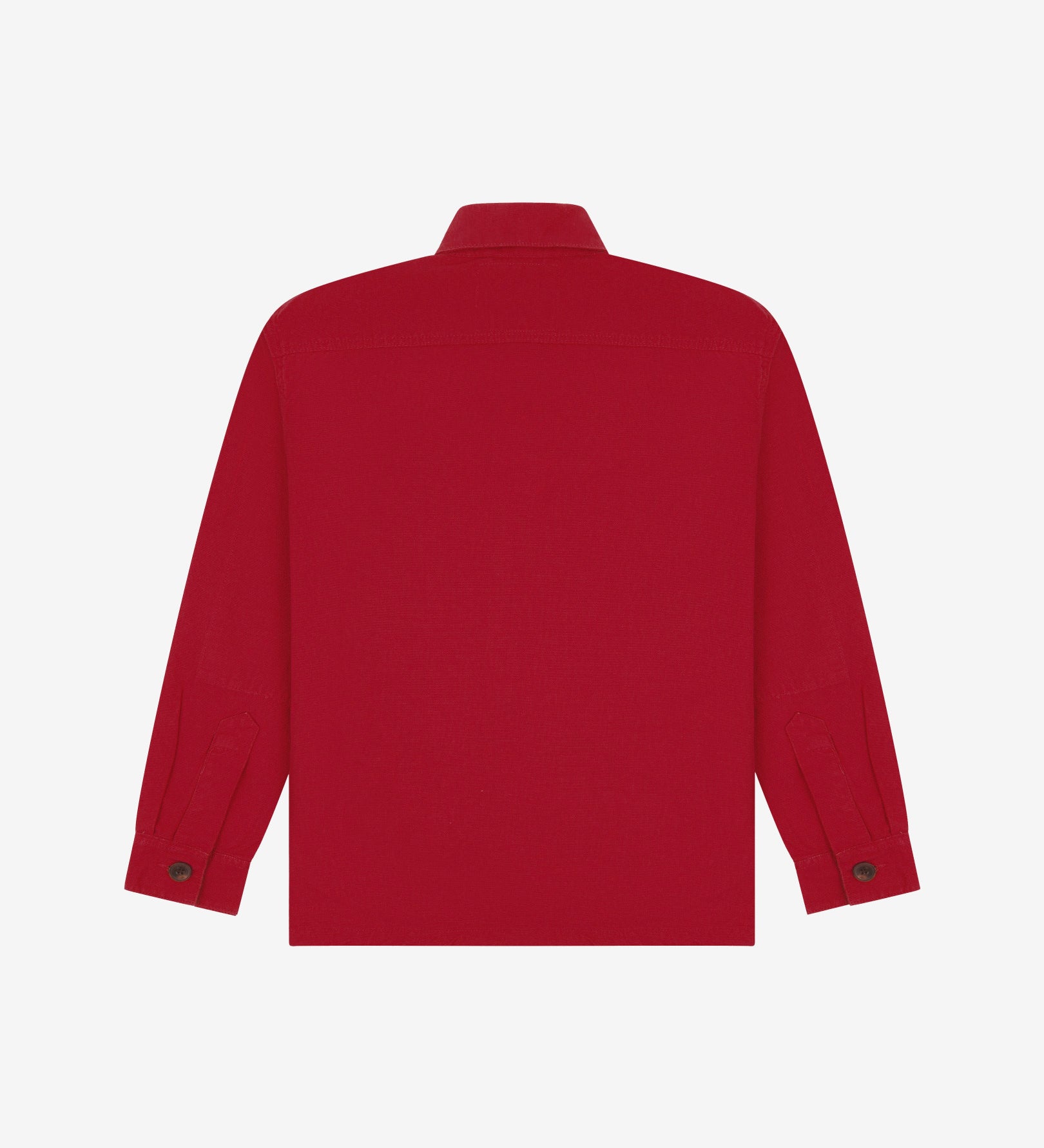 Reverse of berry red buttoned organic cotton workshirt from Uskees showing reinforced elbows, tailored cuffs and boxy profile.