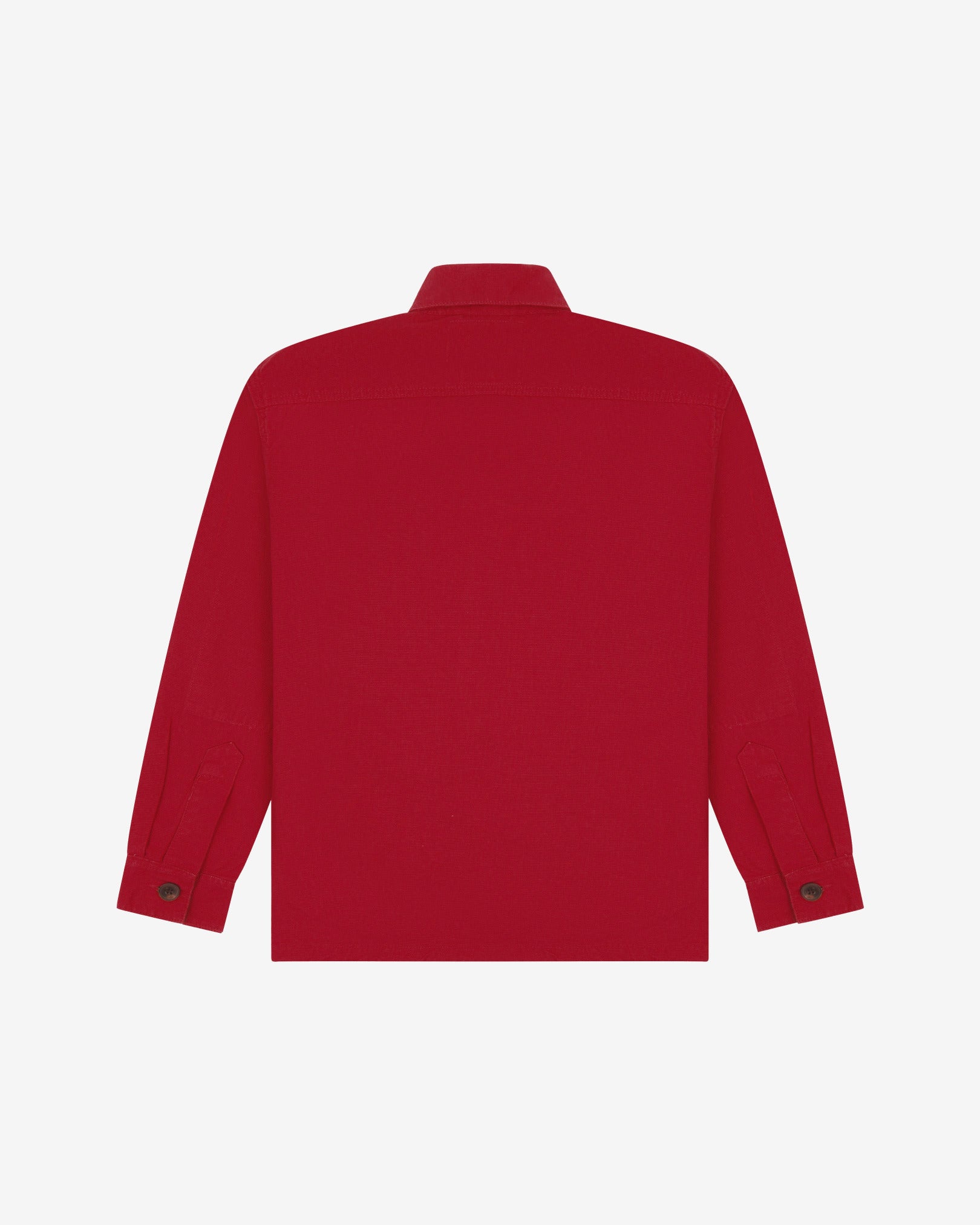 Reverse of berry red buttoned organic cotton workshirt from Uskees showing reinforced elbows, tailored cuffs and boxy profile.