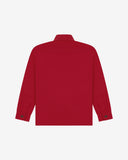 Reverse of berry red buttoned organic cotton workshirt from Uskees showing reinforced elbows, tailored cuffs and boxy profile.