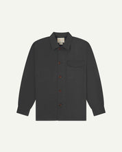 Charcoal buttoned organic cotton overshirt from Uskees with clear view of chest pocket and Uskees branding label.