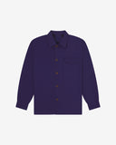 Deep indigo buttoned organic cotton workshirt from Uskees with clear view of chest pocket and utilitarian silhouette.
