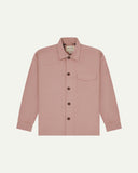 Front flat shot of pale pink buttoned 3003 workshirt from Uskees. Showing chest pocket with flap and corozo buttons.