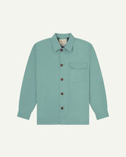 Eucalyptus (mint-green) buttoned organic cotton workshirt from Uskees with clear view of chest pocket and Uskees branding label.