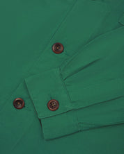 View of the mid-section and sleeve of the 3003 Uskees button-down work shirt in mint green with focus on cuff, placket and corozo buttons.