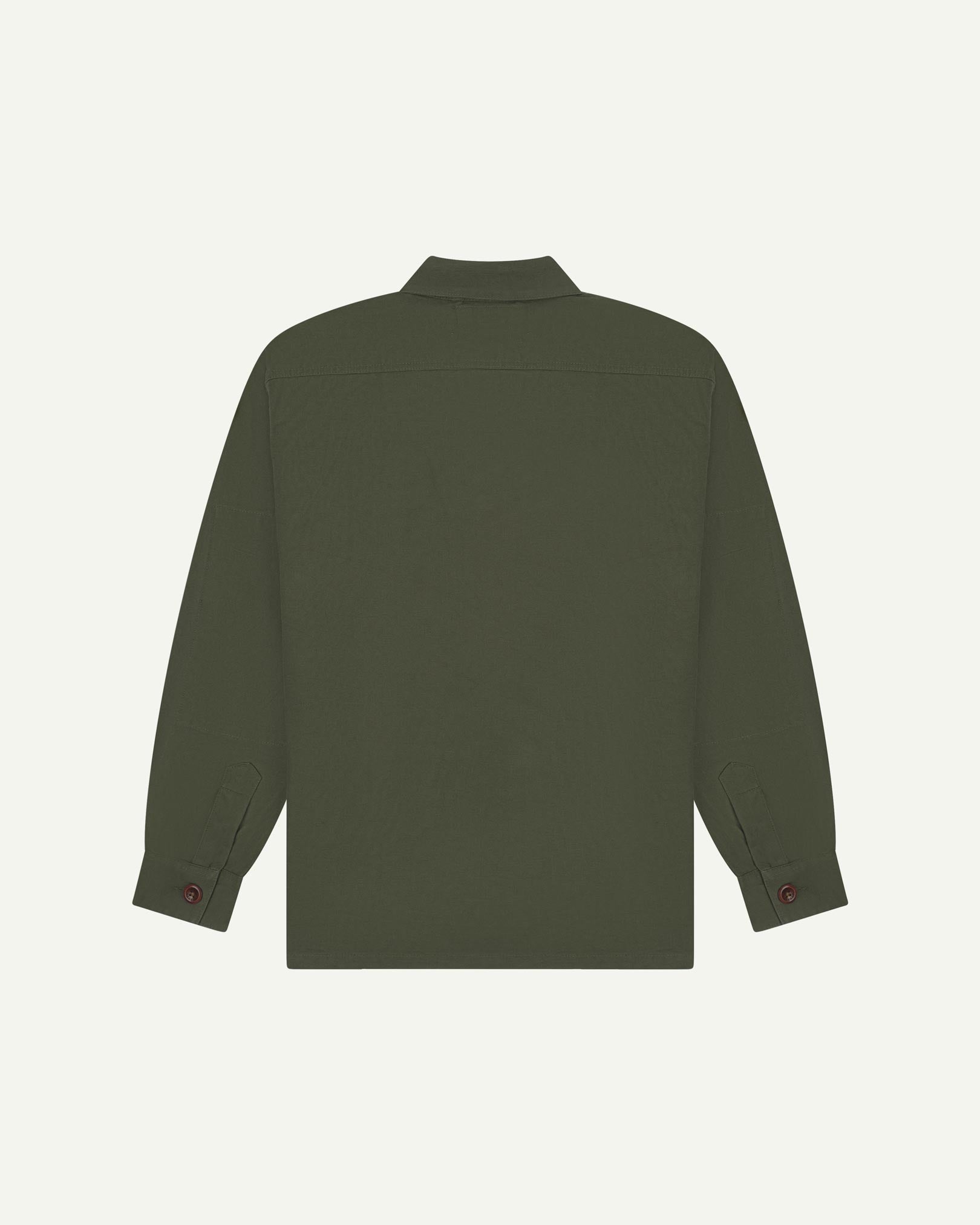 Reverse of vine green buttoned organic cotton workshirt from Uskees showing reinforced elbows, tailored cuffs and boxy silhouette.