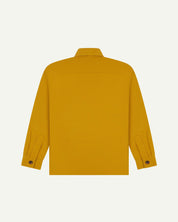 Reverse of yellow buttoned organic cotton workshirt from Uskees showing reinforced elbows, tailored cuffs and boxy silhouette.