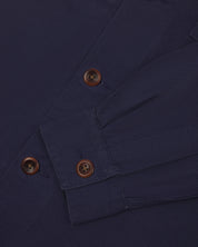 Front flat close shot of dark blue #3003 workshirt for men from Uskees. Showing cuff/sleeve detail and corozo buttons.