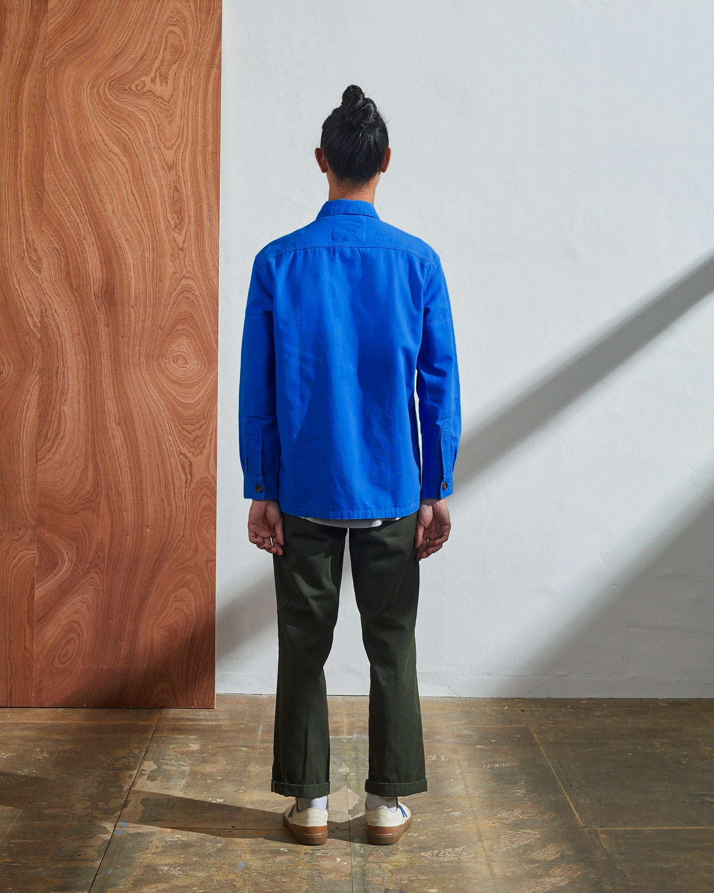 Back model shot of Uskees #3003 buttoned workshirt in ultra blue