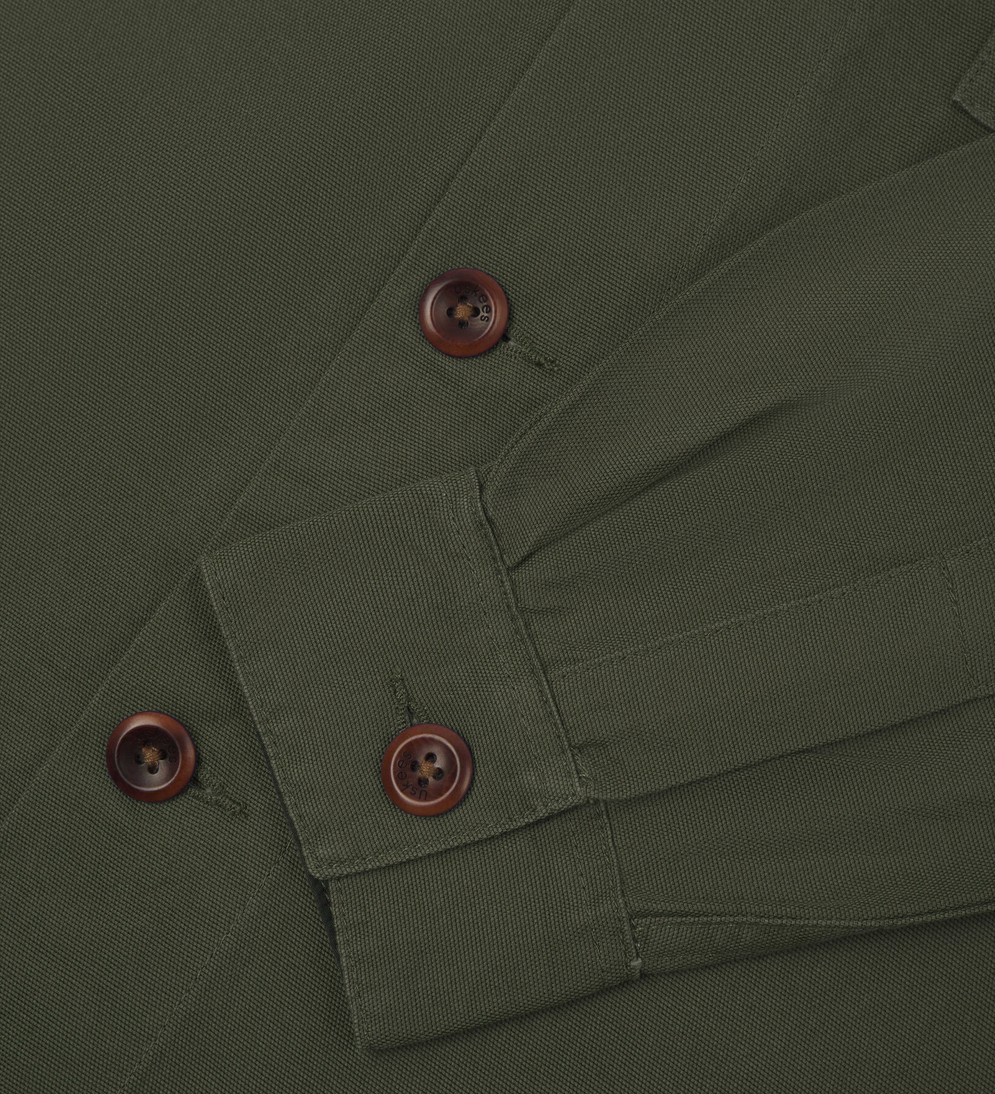sleeve and corozo buttons.