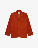 Flat front view of corduroy rust-red blazer with 3 patch pockets from Uskees. Clearly showing corozo buttons and 3 pockets.