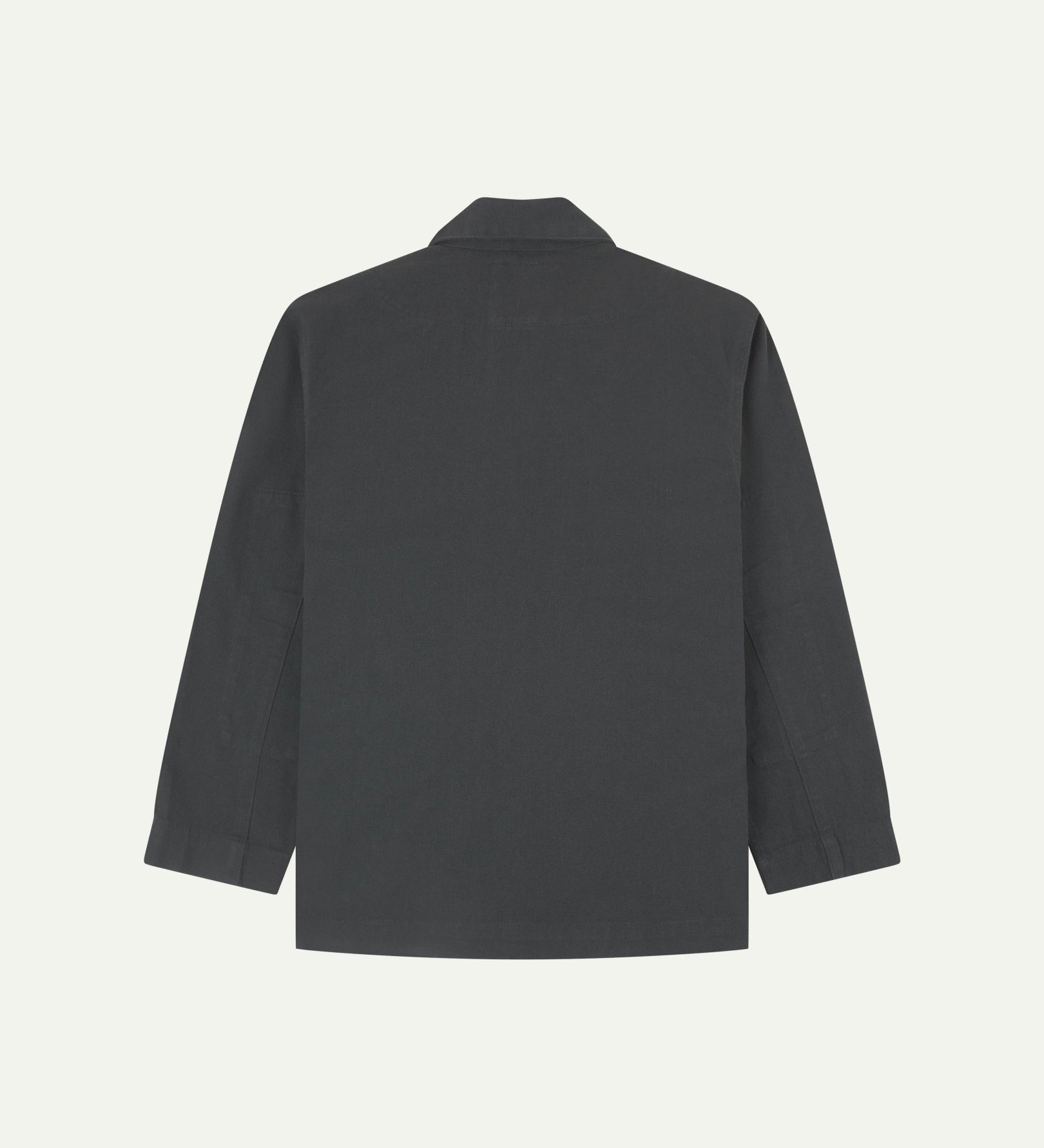 Reverse of charcoal-grey buttoned organic cotton-drill blazer from Uskees showing reinforced elbows and boxy silhouette.