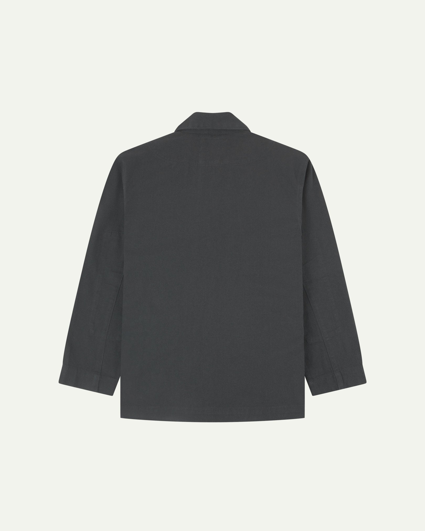 Reverse of charcoal-grey buttoned organic cotton-drill blazer from Uskees showing reinforced elbows and boxy silhouette.