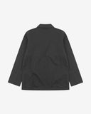 Reverse of charcoal-grey buttoned organic cotton-twill blazer from Uskees showing reinforced elbows and boxy silhouette.