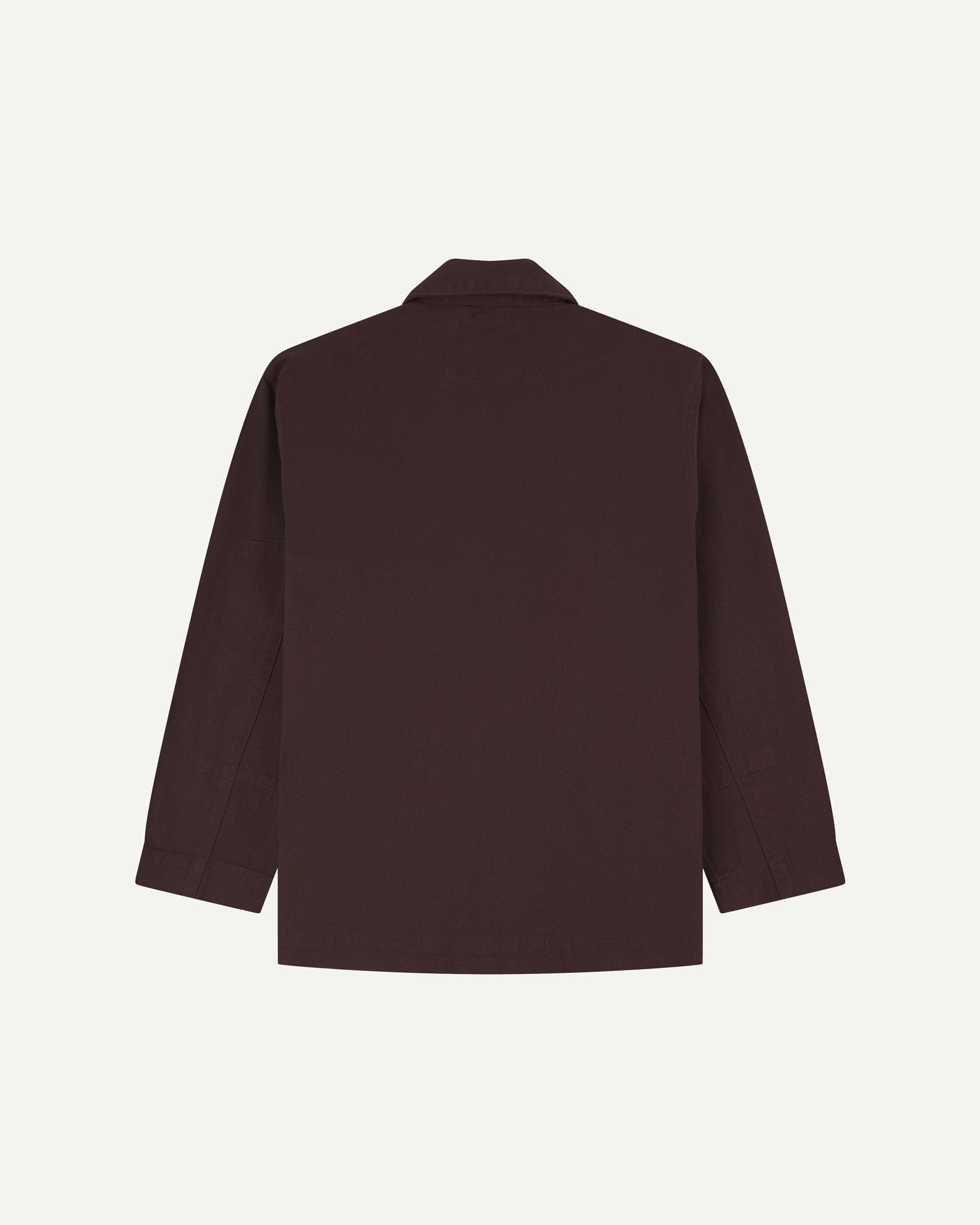 Reverse of burgundy-brown buttoned organic cotton-drill blazer from Uskees showing reinforced elbows and boxy silhouette.