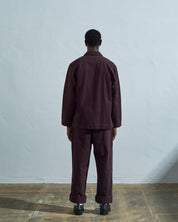Reverse view of Uskees #3006 dark plum organic cotton drill blazer with view of reinforced elbows.