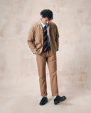 Full-length view of man wearing the 3006 khaki blazer from Uskees, paired with matching khaki workwear pants.