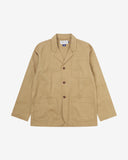 Full front view of khaki buttoned organic cotton-twill blazer with clear view of three patch pockets and Uskees branding label.