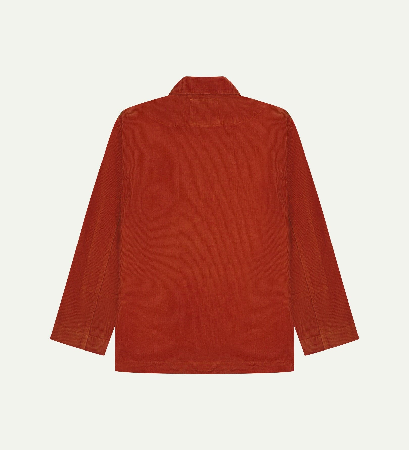 Flat back view of corduroy rust-red blazer from Uskees with view of reinforced elbows and indicating contemporary, boxy fit.