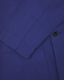 Closer detail view of patch pockets, cuff detailing, corozo buttons and extra durable weave of the organic cotton drill fabric.