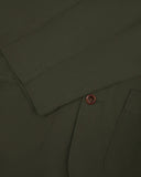 Close-up view of cuff and placket of organic cotton, vine green blazer from Uskees.
