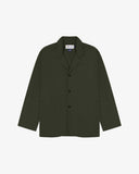 Vine green buttoned organic cotton-drill blazer from Uskees with clear view of three patch pockets and Uskees branding label.