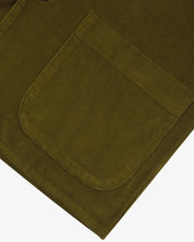 Close-up of an uskees green cord men's blazer showing the pocket  detail on a white background