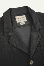 Flat front close view of dark grey #3006 corduroy blazer with view of collar, brand/size label and Uskees branding label.